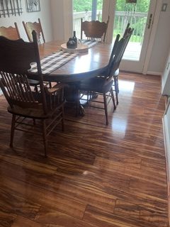 Clean dining area with polished wood floors in a Harford County home