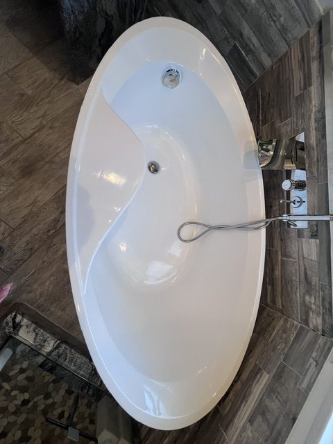 Clean freestanding tub maintained with Luxe Package weekly cleaning in Bel Air MD